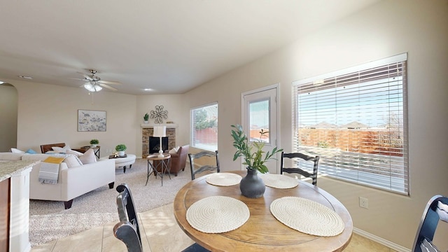 dining area featuring light tile patterned floors and ceiling fan