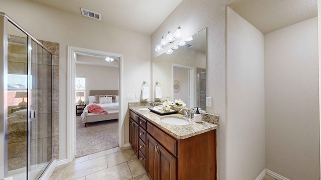 bathroom with vanity, tile patterned floors, and walk in shower