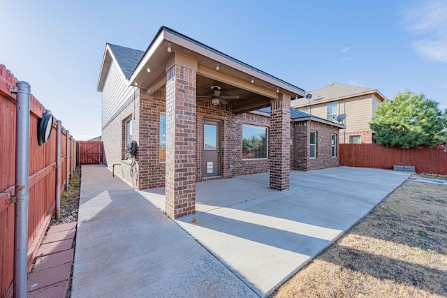 back of house with a patio area and ceiling fan