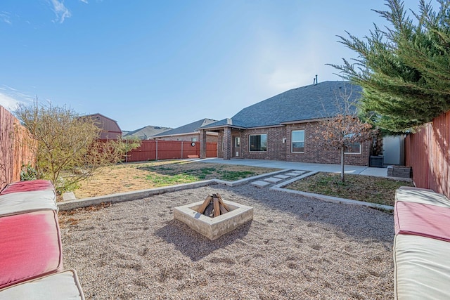 view of yard featuring a patio area and an outdoor fire pit