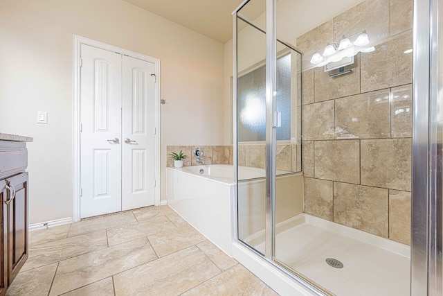 bathroom featuring vanity and plus walk in shower