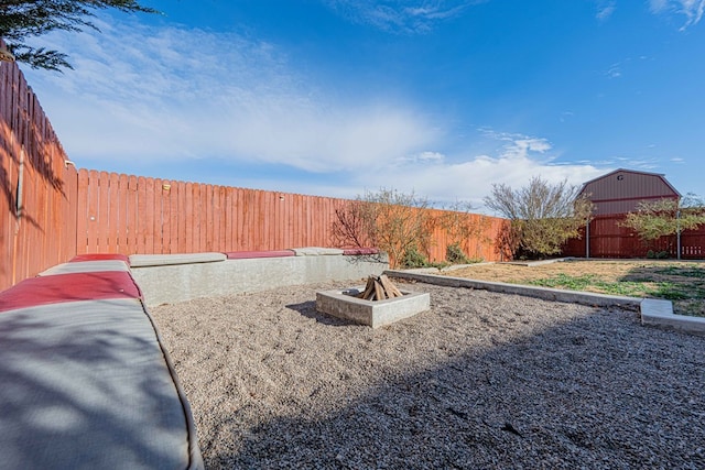 view of yard with a fire pit