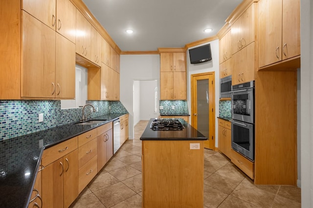 kitchen with dark stone counters, sink, a kitchen island, and stainless steel appliances