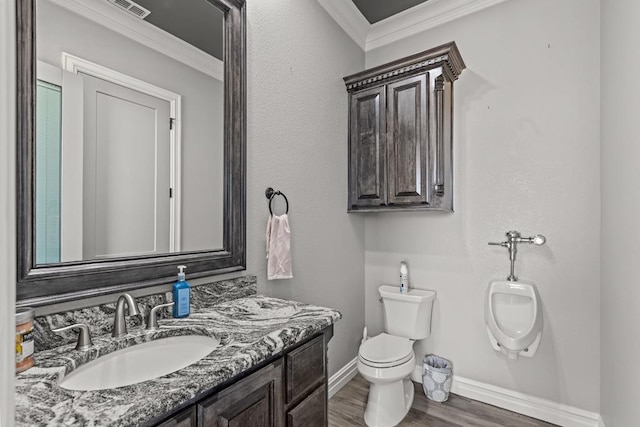 bathroom with ornamental molding, wood-type flooring, vanity, and toilet