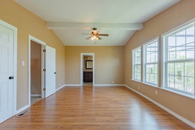 interior space with vaulted ceiling with beams, ceiling fan, and light wood-type flooring