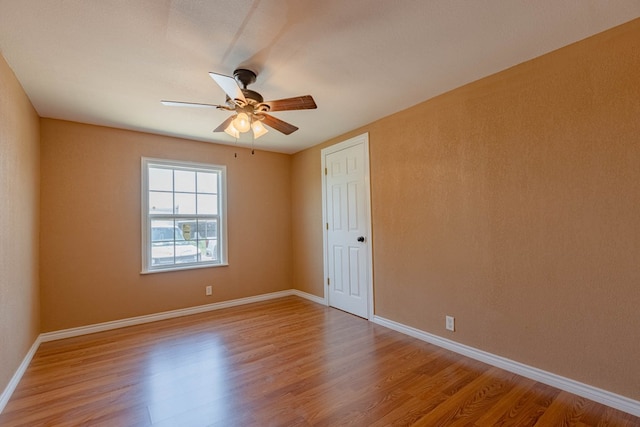 unfurnished room with light hardwood / wood-style floors and ceiling fan