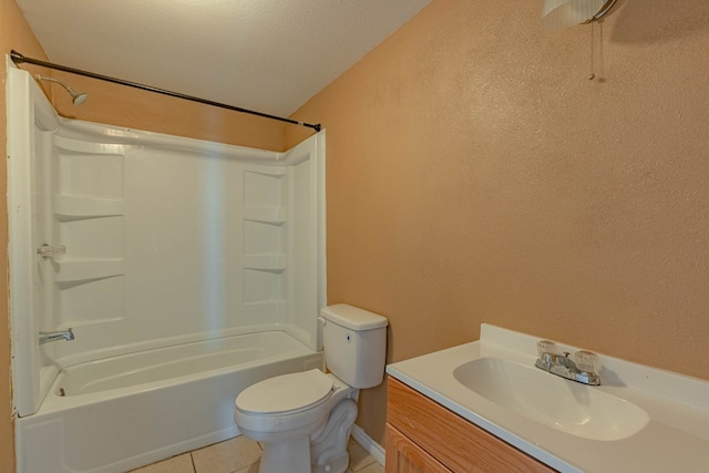 full bathroom with vanity, tile patterned floors, washtub / shower combination, toilet, and a textured ceiling