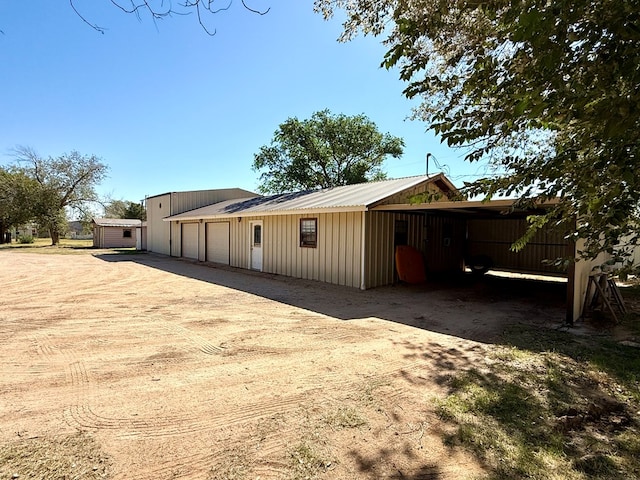 exterior space with a carport