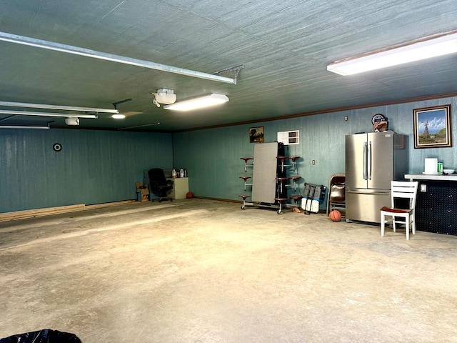 garage with stainless steel fridge