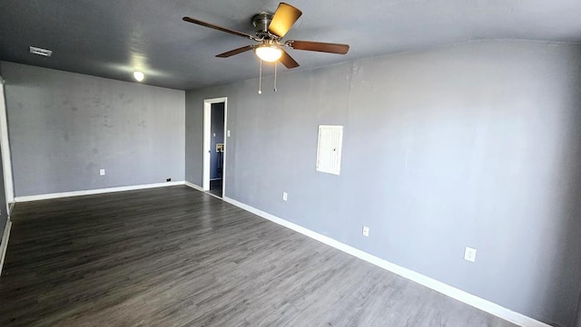 empty room with ceiling fan and dark hardwood / wood-style floors