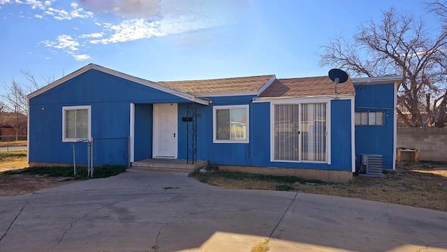 view of front of home featuring central AC unit