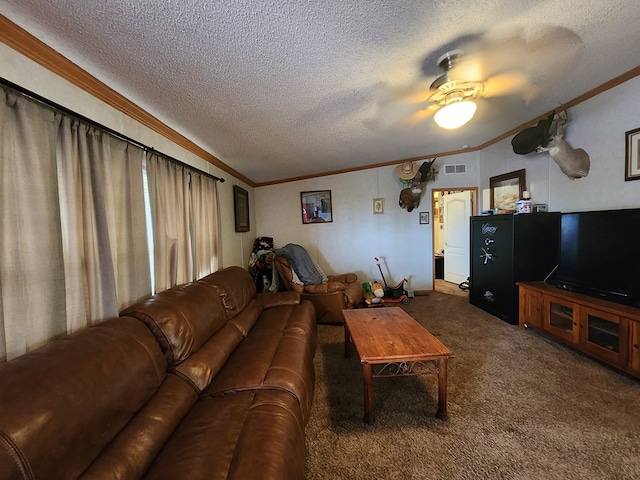 living room with ceiling fan, dark carpet, a textured ceiling, and ornamental molding