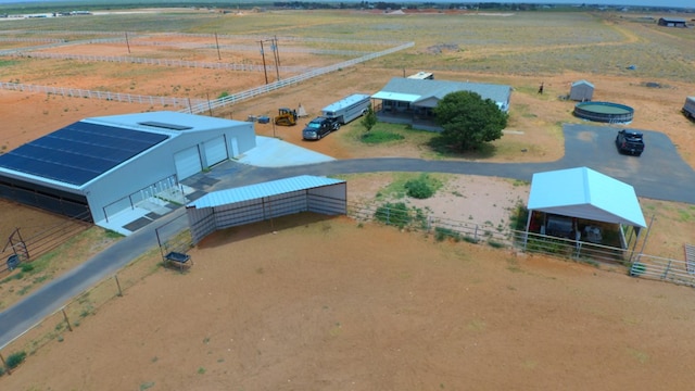 birds eye view of property featuring a rural view