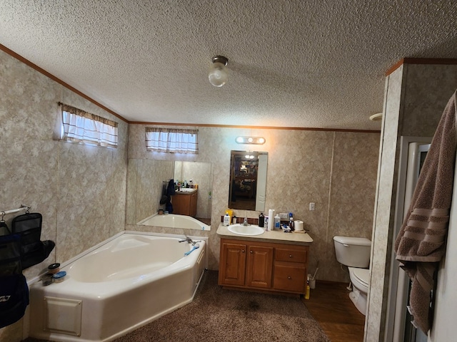 bathroom featuring a bath, crown molding, hardwood / wood-style floors, a textured ceiling, and vanity