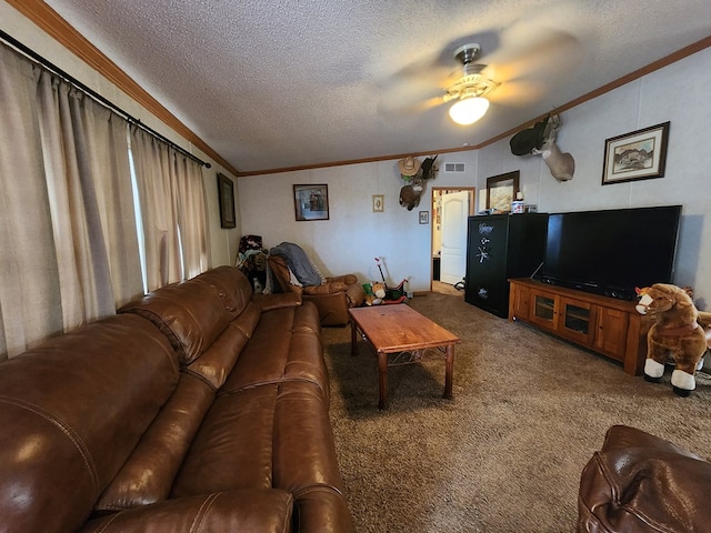 carpeted living room with a textured ceiling, ceiling fan, and ornamental molding