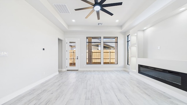 unfurnished living room with light wood-style flooring, recessed lighting, visible vents, and baseboards