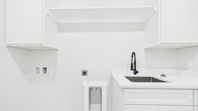 laundry area featuring washer hookup, a sink, cabinet space, and hookup for an electric dryer