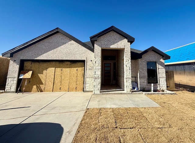 view of front of property with a garage