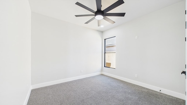 empty room featuring carpet floors, baseboards, and a ceiling fan