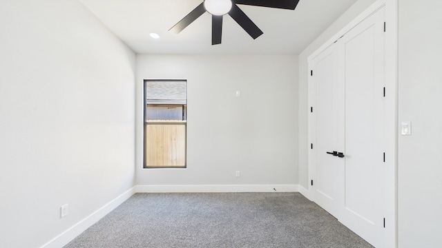 unfurnished bedroom with a ceiling fan, a closet, carpet flooring, and baseboards