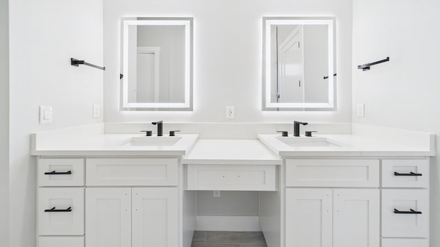 bathroom featuring double vanity and a sink