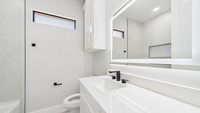 bathroom featuring baseboards, toilet, vanity, a bath, and recessed lighting