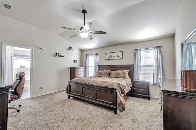 carpeted bedroom featuring connected bathroom, ceiling fan, and lofted ceiling