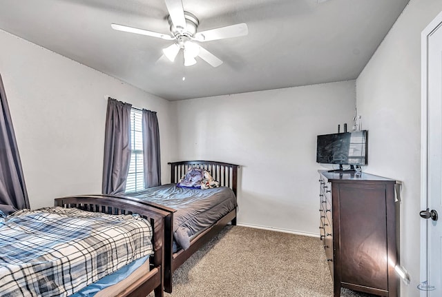 bedroom featuring ceiling fan and light colored carpet