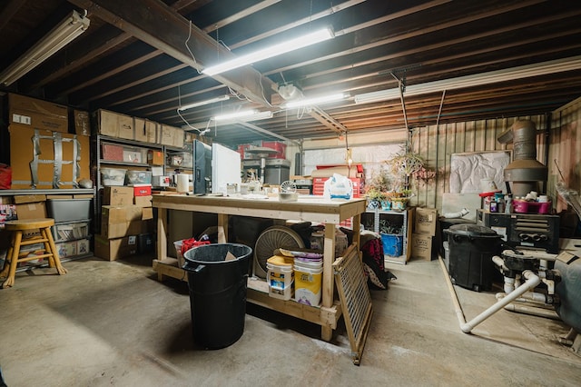 unfinished basement with a workshop area