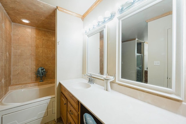 full bathroom featuring crown molding, a bath, and vanity