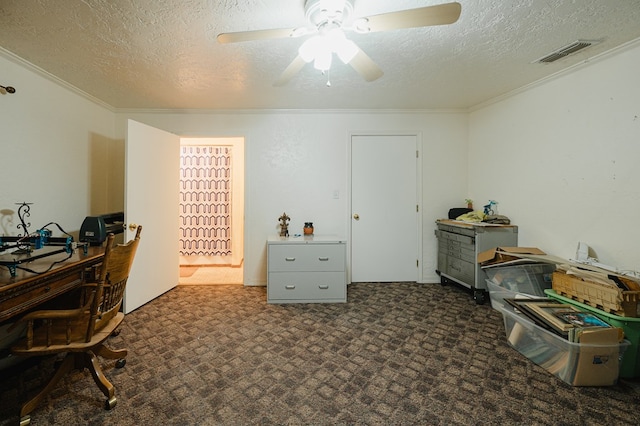 office area featuring ornamental molding, visible vents, a textured ceiling, and a ceiling fan