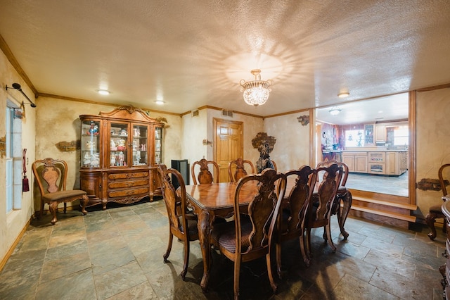 dining area with crown molding, a textured ceiling, baseboards, and stone tile floors