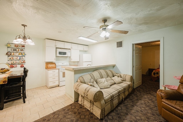 living room featuring light tile patterned floors, visible vents, a textured ceiling, and ceiling fan with notable chandelier