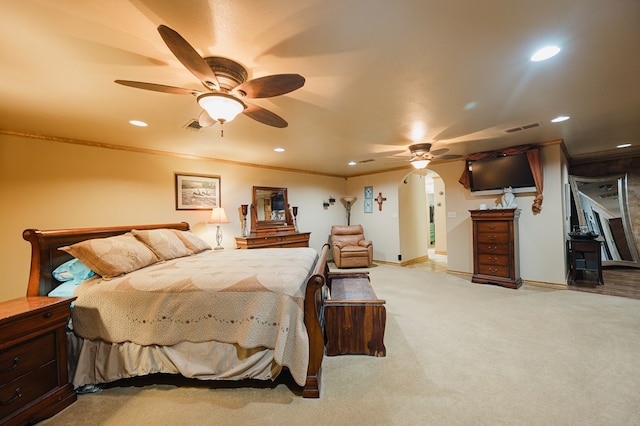 bedroom with recessed lighting, light colored carpet, visible vents, and crown molding