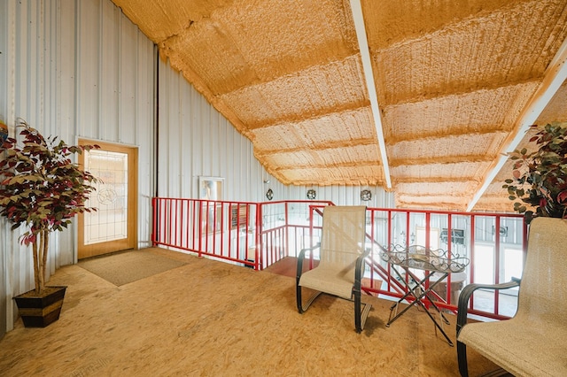 living area featuring lofted ceiling