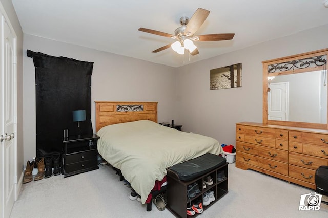 bedroom with light colored carpet and ceiling fan