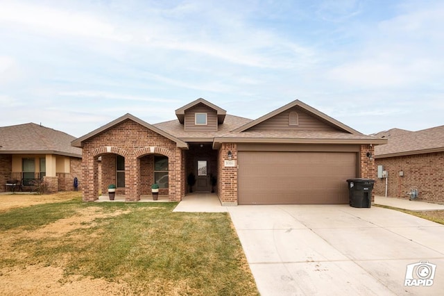 view of front of house with a garage and a front lawn