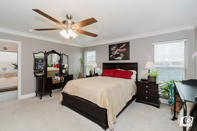 bedroom with ensuite bathroom, crown molding, light carpet, and ceiling fan