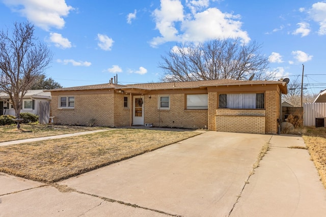 ranch-style home with a front lawn