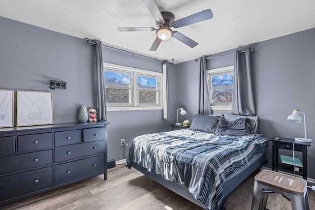 bedroom featuring light hardwood / wood-style floors and ceiling fan