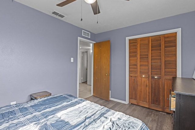 unfurnished bedroom with hardwood / wood-style flooring, a closet, and ceiling fan