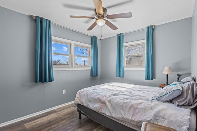 bedroom featuring ceiling fan and dark hardwood / wood-style floors