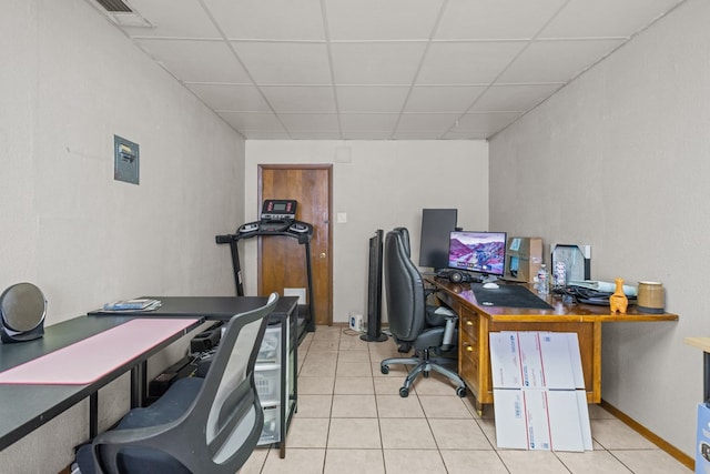 office featuring light tile patterned floors and a drop ceiling