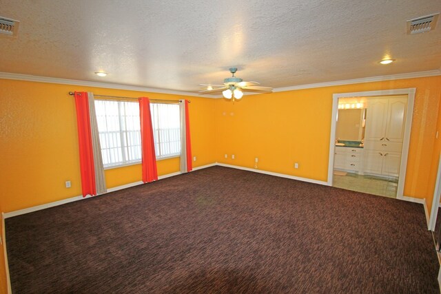 spare room with carpet, a textured ceiling, ceiling fan, and crown molding