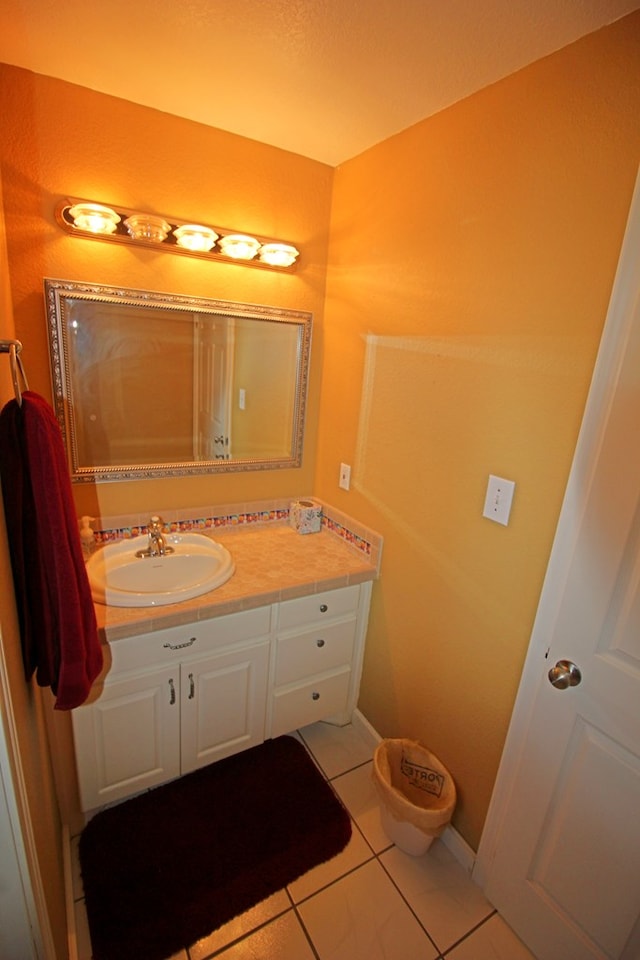 bathroom with tile patterned flooring and vanity