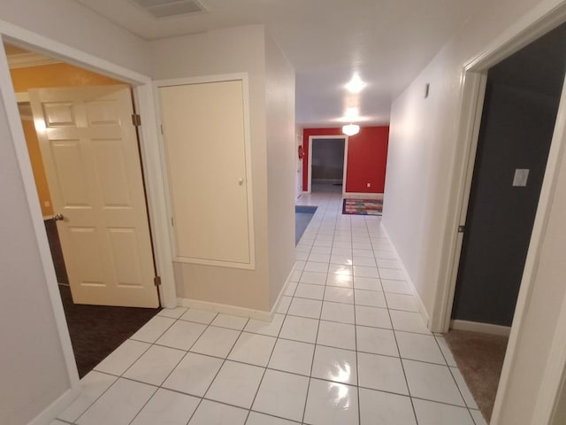 hall with light tile patterned flooring