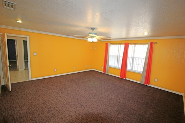 empty room with carpet, a textured ceiling, ceiling fan, and ornamental molding