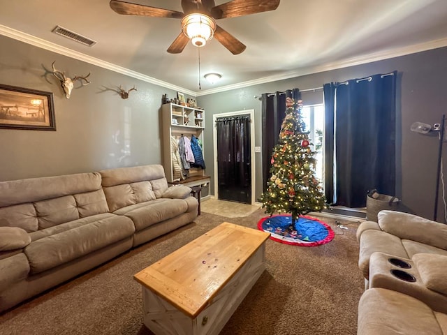 carpeted living room with ceiling fan and ornamental molding