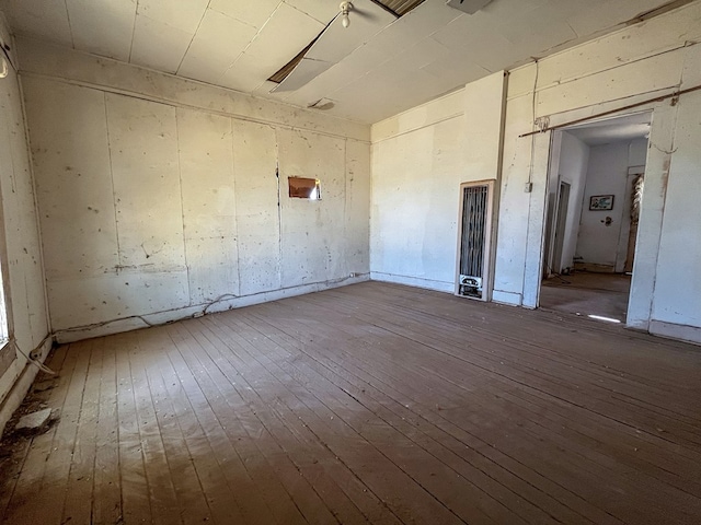 unfurnished room with hardwood / wood-style floors