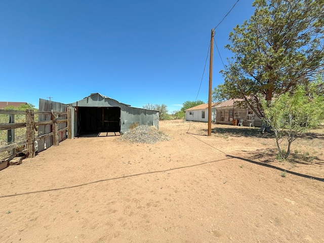 view of home's community with an outdoor structure